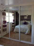 3 mirror sliding doors with white frames