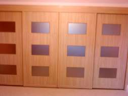Stylo wood doors with a matt bronze glass