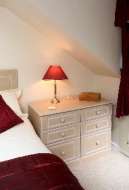 Freestanding bedside chest to accompany the fitted drawers