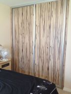 Artwood panel doors with matt silver frames, making a bold impression in the room (angled view)
